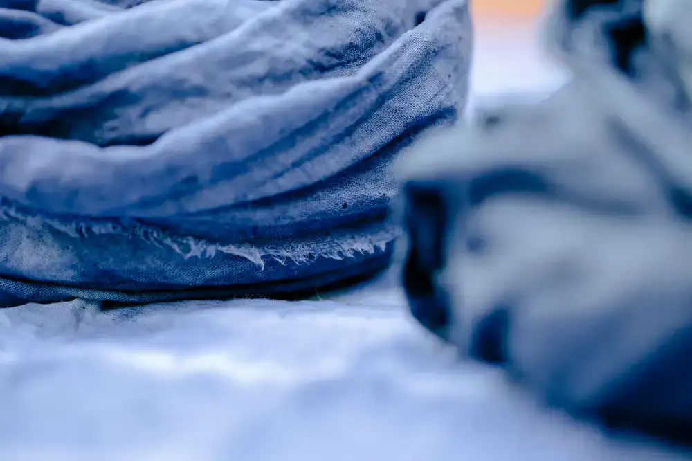 Draped natural linen dyed with indigo