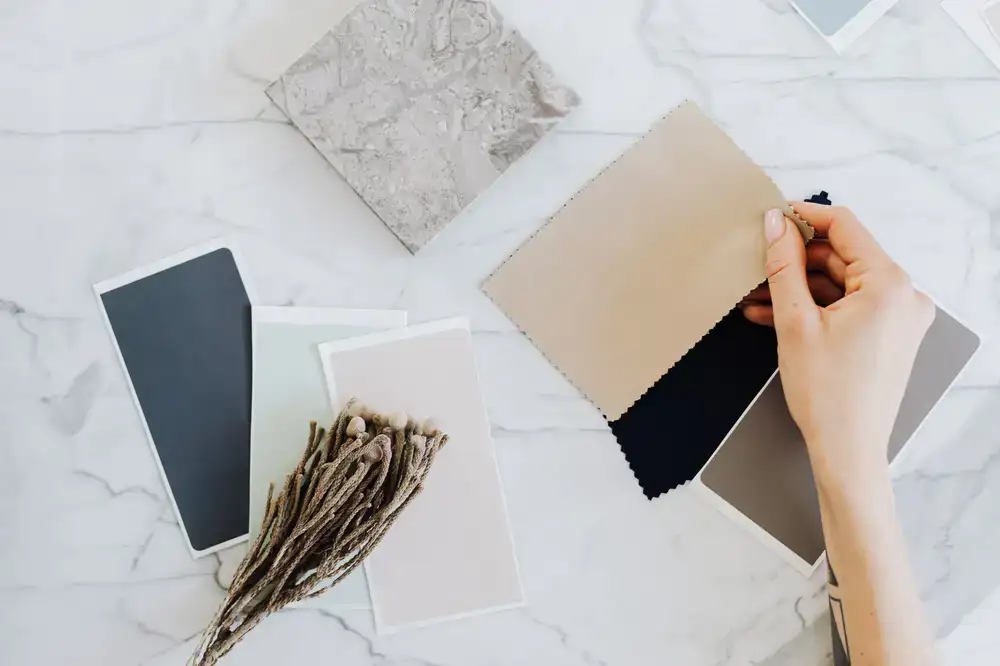 Reviewing fabric swatches and botanical color palettes