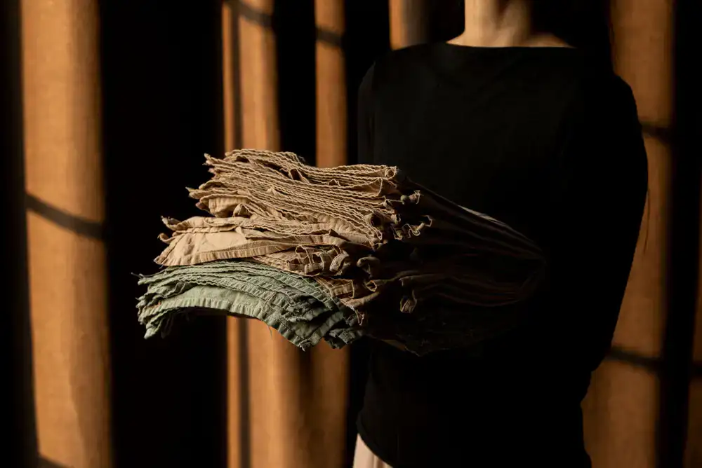 Folded hand-dyed fabrics with earthy tones